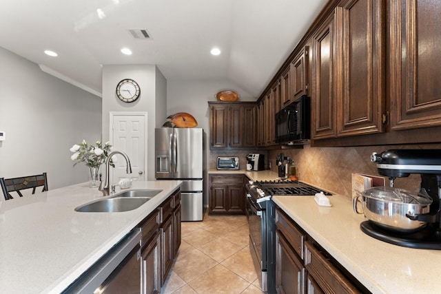 13510 Marblepointe Ln, Cypress, TX 77429 - kitchen with stainless steel appliances, a sink, light countertops, decorative backsplash, and recessed lighting