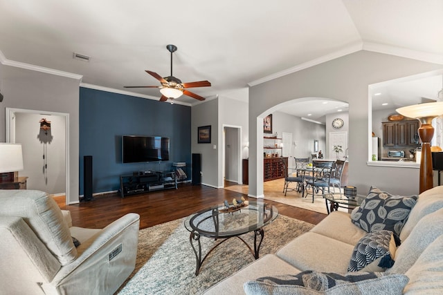 13510 Marblepointe Ln, Cypress, TX 77429 - living room featuring arched walkways, wood finished floors, ceiling fan, baseboards, and crown molding