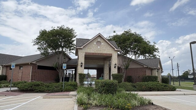 view of property with uncovered parking