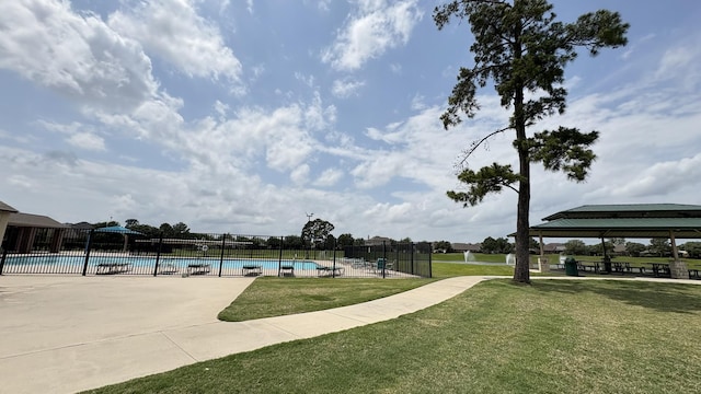 exterior space with a gazebo, fence, and a yard
