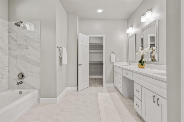 8161 Crestview Dr, Houston, TX 77028 - full bathroom with double vanity, a spacious closet, tile patterned flooring, shower / bath combination, and baseboards
