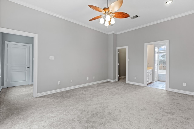 unfurnished bedroom with carpet flooring, connected bathroom, baseboards, visible vents, and ornamental molding