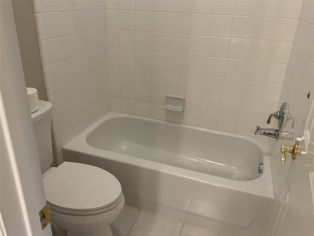 bathroom featuring tile patterned flooring and toilet