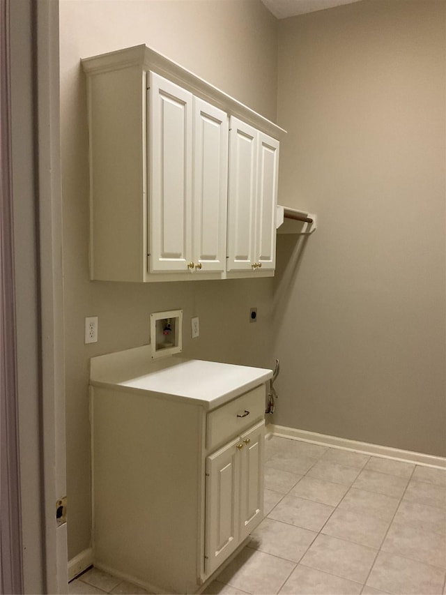 laundry room with cabinet space, light tile patterned flooring, washer hookup, baseboards, and hookup for an electric dryer