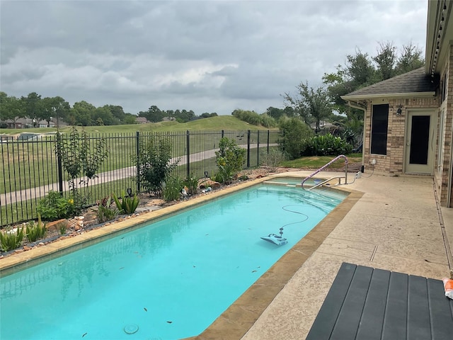 view of pool featuring a fenced in pool, a patio area, and fence