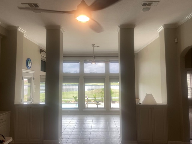 living area with visible vents, ornamental molding, decorative columns, and tile patterned floors