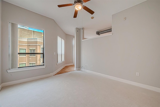 spare room featuring baseboards, carpet, and a ceiling fan