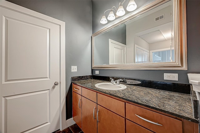 bathroom featuring visible vents and vanity