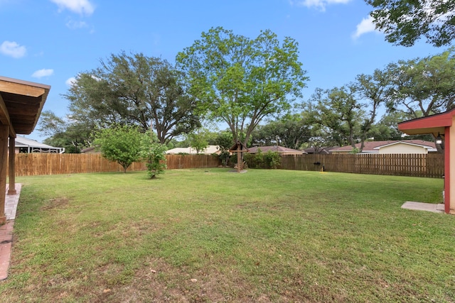 view of yard featuring a fenced backyard