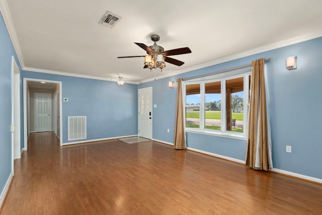 unfurnished room with crown molding, ceiling fan, and visible vents