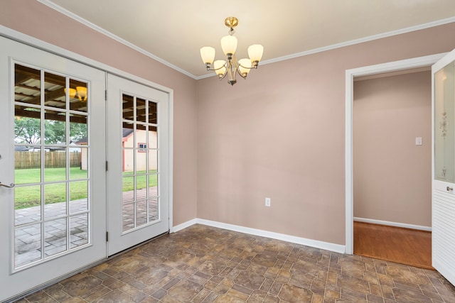 unfurnished dining area with crown molding, baseboards, an inviting chandelier, and stone finish floor