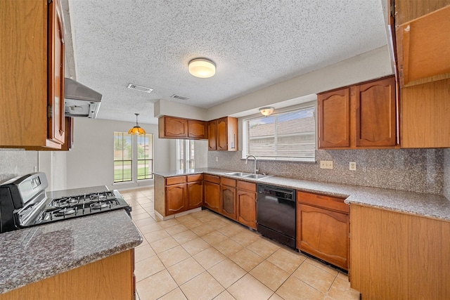 kitchen with brown cabinets, a sink, black dishwasher, a peninsula, and gas range