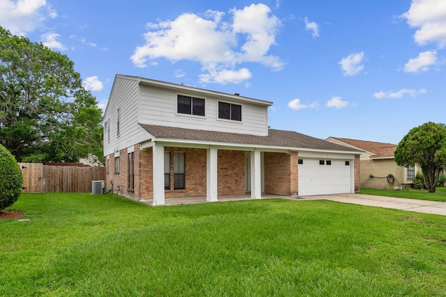 view of front of property with a front lawn, fence, brick siding, concrete driveway, and an attached garage