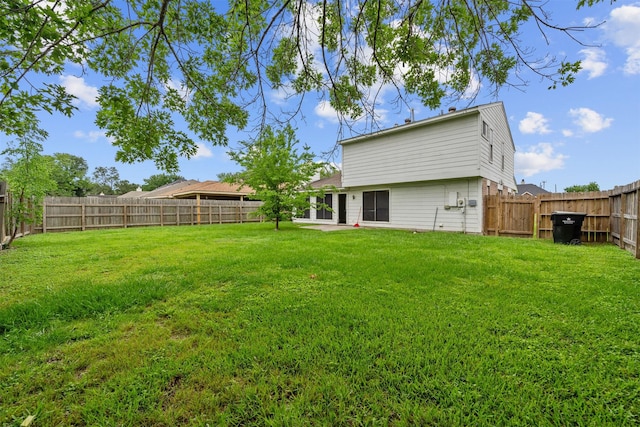 view of yard with a fenced backyard and a patio