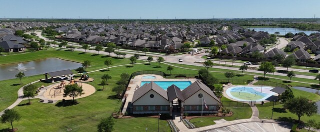 3009 Kurth Canyon Ct, League City, TX 77573 - aerial view of residential area with a nearby body of water and a pool area