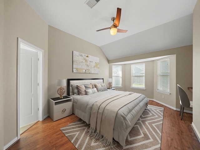 3009 Kurth Canyon Ct, League City, TX 77573 - bedroom featuring wood finished floors, vaulted ceiling, baseboards, and ceiling fan