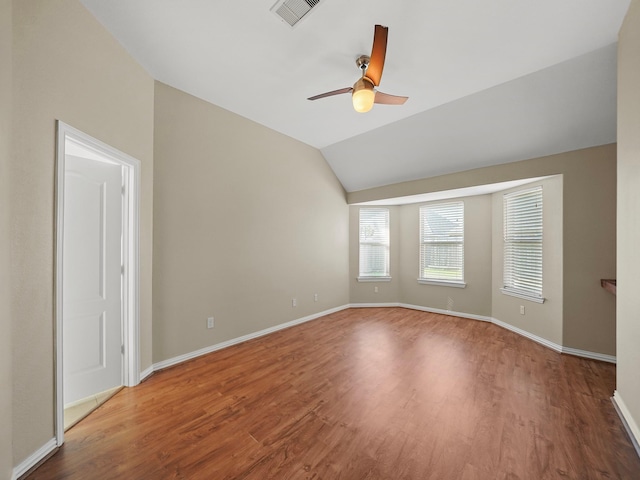3009 Kurth Canyon Ct, League City, TX 77573 - unfurnished room featuring wood finished floors, a ceiling fan, baseboards, and lofted ceiling