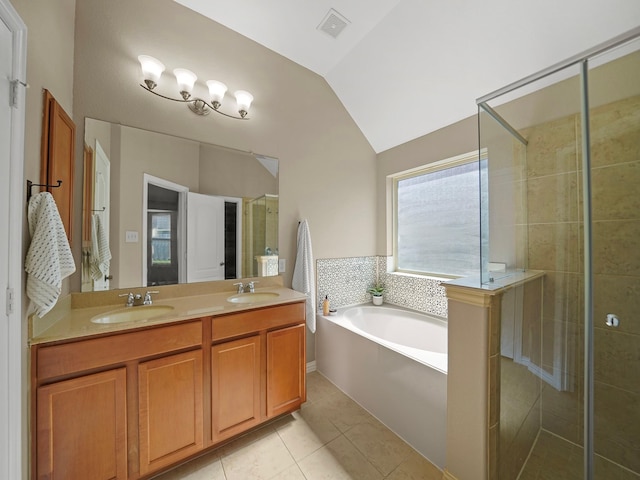 3009 Kurth Canyon Ct, League City, TX 77573 - bathroom featuring vaulted ceiling, a stall shower, a bath, tile patterned flooring, and double vanity