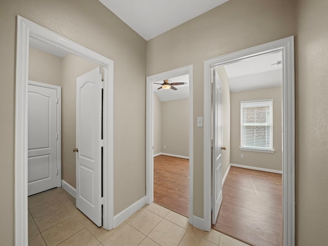 3009 Kurth Canyon Ct, League City, TX 77573 - hallway featuring light tile patterned floors and baseboards