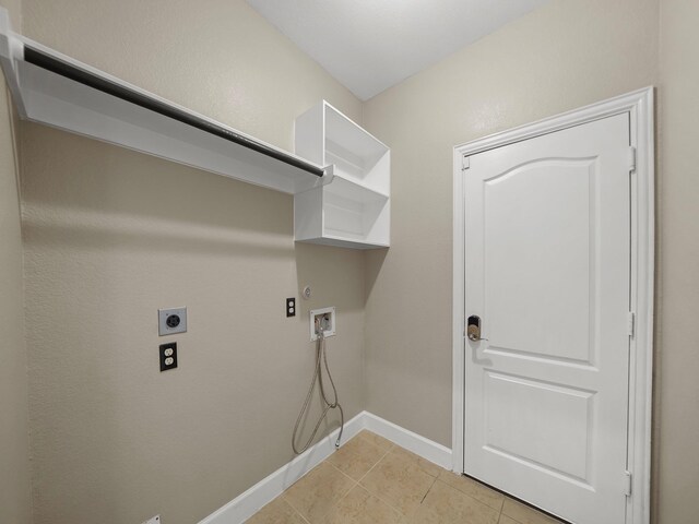 3009 Kurth Canyon Ct, League City, TX 77573 - clothes washing area with electric dryer hookup, washer hookup, gas dryer hookup, light tile patterned floors, and baseboards