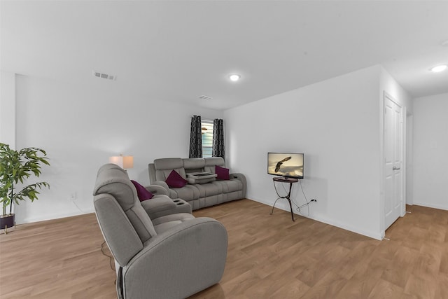 16435 Valerie Marie Pl, Conroe, TX 77306 - living room featuring visible vents, recessed lighting, baseboards, and light wood-type flooring