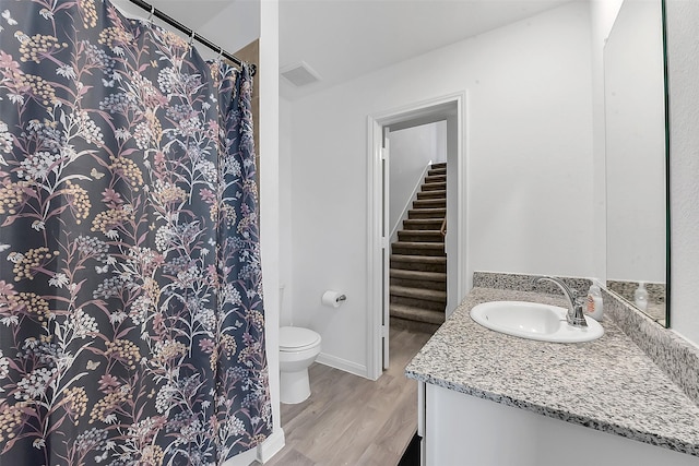 16435 Valerie Marie Pl, Conroe, TX 77306 - full bath with vanity, toilet, a shower with shower curtain, wood finished floors, and visible vents