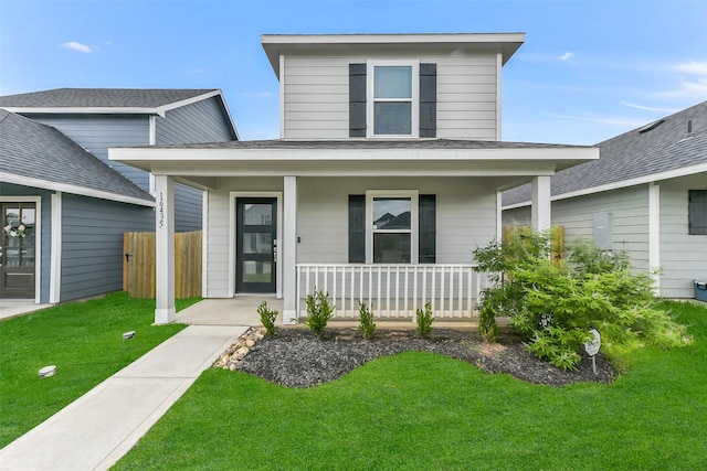 16435 Valerie Marie Pl, Conroe, TX 77306 - view of front of property featuring a porch, roof with shingles, fence, and a front yard