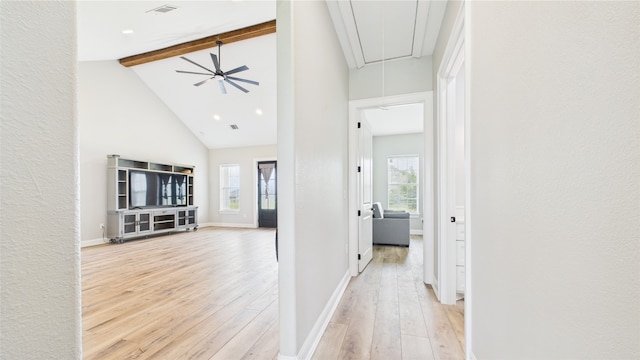 hallway featuring high vaulted ceiling, light wood-style flooring, attic access, beamed ceiling, and visible vents