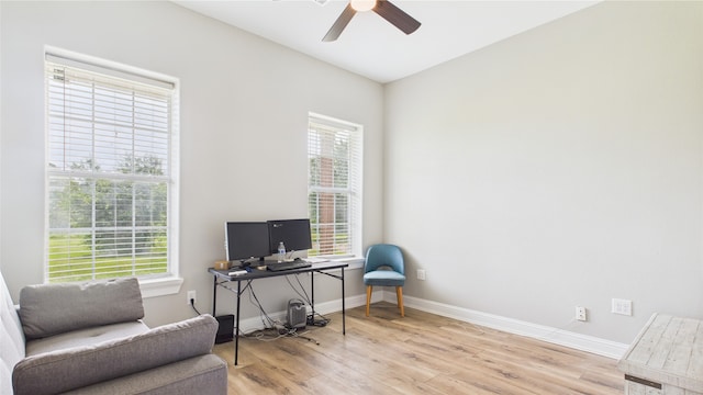 office space with baseboards, a ceiling fan, and wood finished floors