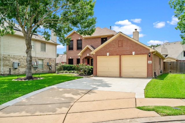 traditional-style home featuring a garage, a chimney, concrete driveway, and a front yard