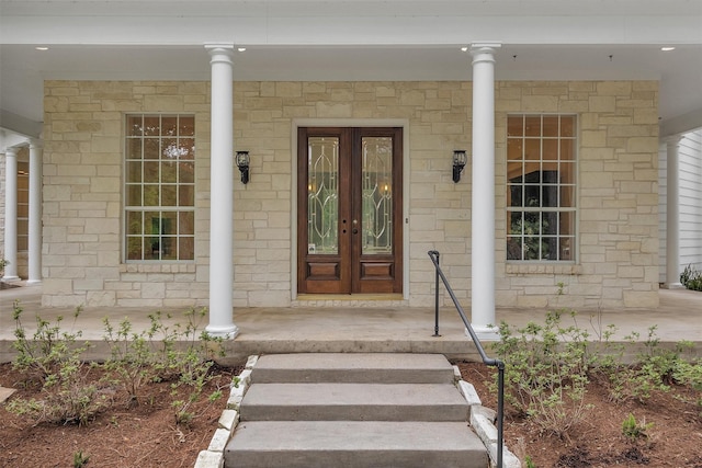 entrance to property featuring french doors and a porch