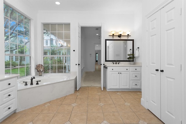 full bathroom with vanity, ornamental molding, recessed lighting, a bath, and tile patterned floors