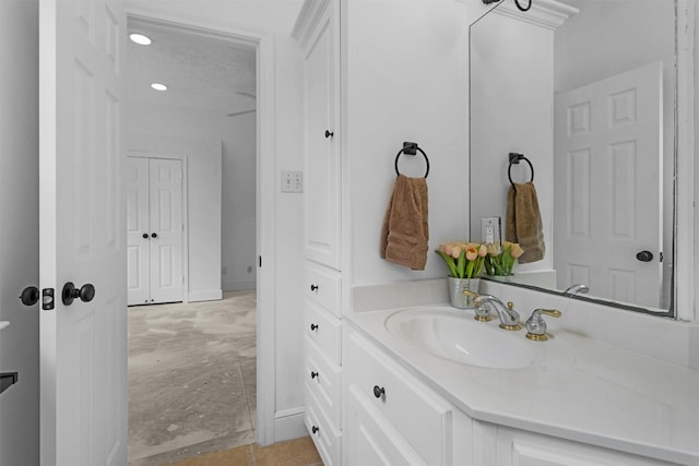 bathroom with vanity and baseboards