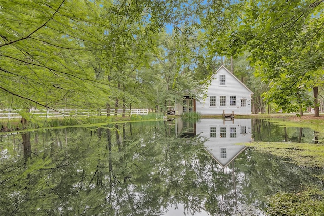 view of home's exterior with a water view