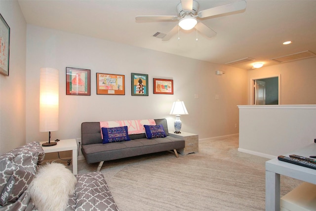 living room featuring visible vents, carpet flooring, baseboards, and ceiling fan