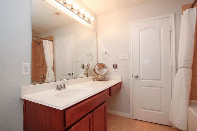 full bathroom featuring vanity, tile patterned flooring, and visible vents