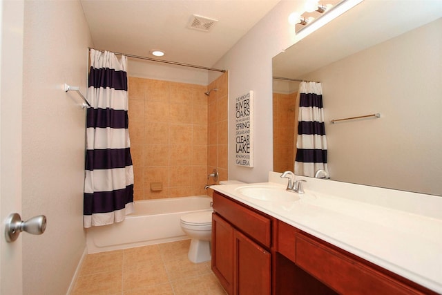 full bath with visible vents, shower / bath combo, vanity, tile patterned floors, and toilet