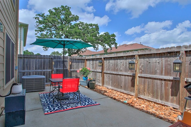 view of patio / terrace with a fenced backyard and cooling unit