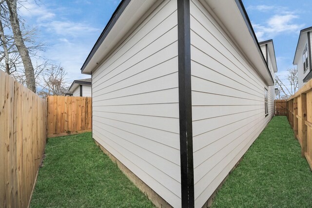 326 Gans St Unit A, Houston, TX 77029 - view of home's exterior with a fenced backyard and a yard