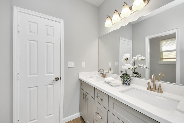 326 Gans St Unit A, Houston, TX 77029 - bathroom with a sink, baseboards, and double vanity