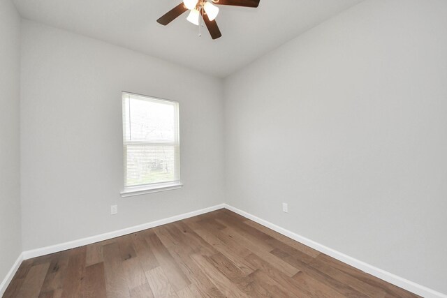 326 Gans St Unit A, Houston, TX 77029 - unfurnished room with baseboards, a ceiling fan, and wood finished floors