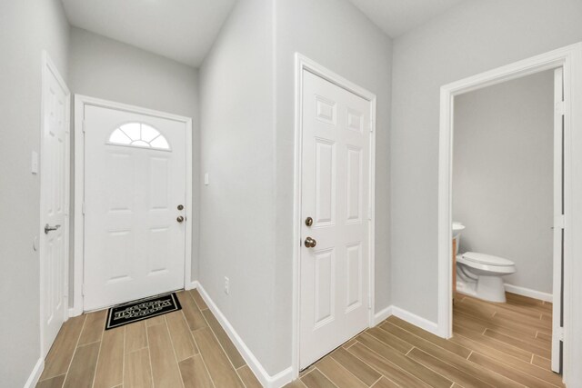 326 Gans St Unit A, Houston, TX 77029 - doorway to outside featuring wood tiled floor and baseboards