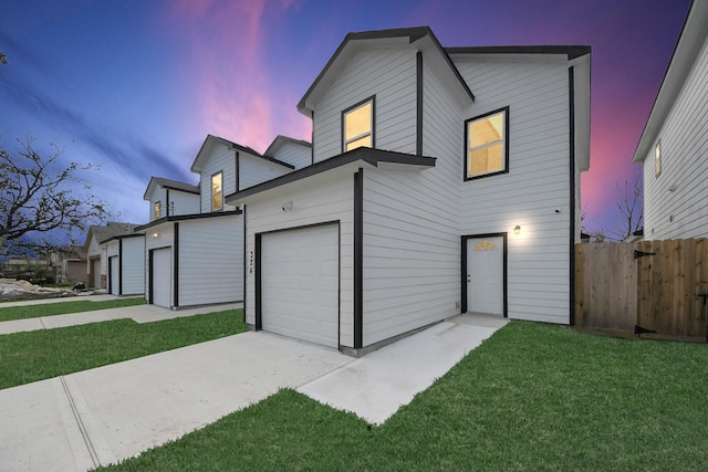 326 Gans St Unit A, Houston, TX 77029 - view of front of home featuring fence, a front lawn, and a garage