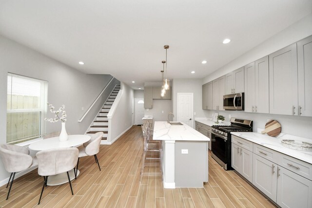 326 Gans St Unit A, Houston, TX 77029 - kitchen featuring recessed lighting, appliances with stainless steel finishes, a sink, and light wood finished floors