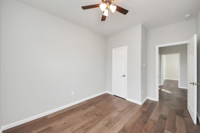 326 Gans St Unit A, Houston, TX 77029 - unfurnished bedroom with baseboards, ceiling fan, and wood finished floors