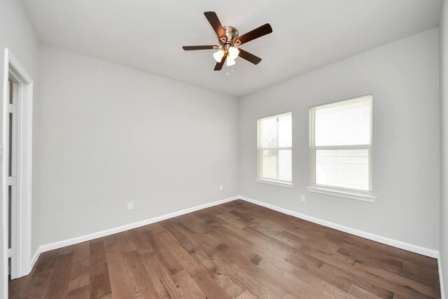 326 Gans St Unit A, Houston, TX 77029 - spare room with baseboards, a ceiling fan, and dark wood finished floors
