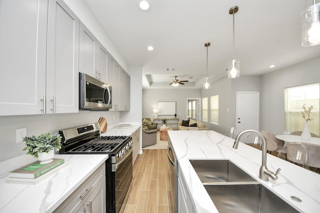 326 Gans St Unit A, Houston, TX 77029 - kitchen featuring ceiling fan, recessed lighting, a sink, hanging light fixtures, and stainless steel appliances