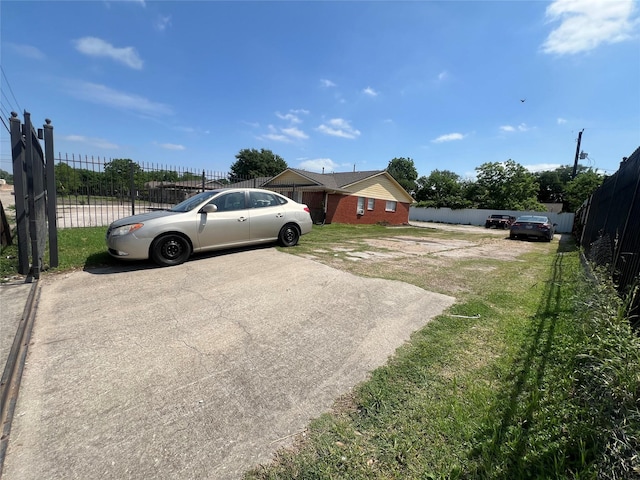 exterior space with fence and driveway
