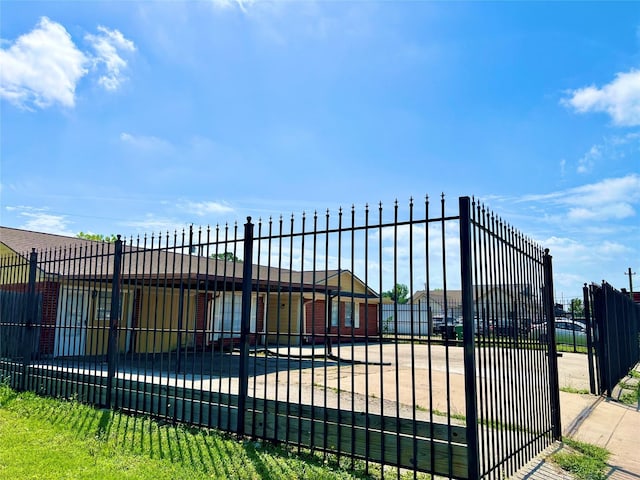 view of gate with fence
