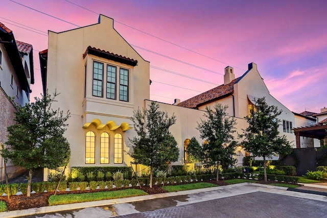 mediterranean / spanish-style home featuring stucco siding